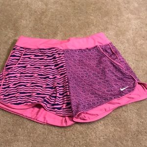 Nike dri-fit pink shorts with navy detailing